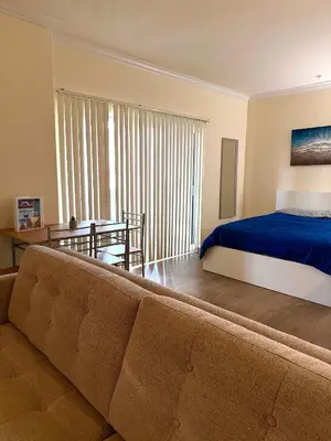 a living room with a couch and a bed at Downtown LA Urban Escape in Los Angeles
