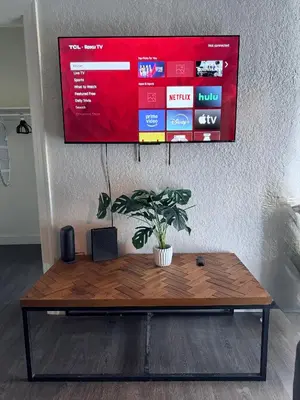 a table with a potted plant on top of it at Wilshire Center K-Town Studio in Los Angeles