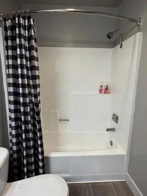 a bathroom with a bath tub and a toilet at Steps from The Hollywood Walk of Fame in Los Angeles