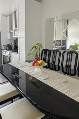 a kitchen with a table with a bowl of fruit on it at Kenmore relax in Los Angeles