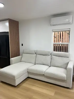 a living room with a white couch in a room at East Hollywood Modern Spacious Bungalow in Los Angeles