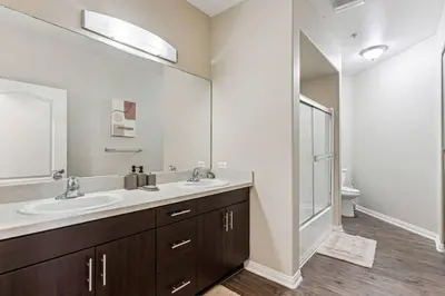 a bathroom with two sinks and a large mirror at Chic Marina Oasis 5 star Amenities Central in Los Angeles