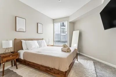 a bedroom with a large bed and a window at Chic Marina Oasis 5 star Amenities Central in Los Angeles