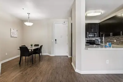 a dining room and kitchen with a table and chairs at Cozy Marina Hideaway Gym Pool & Spa Central in Los Angeles