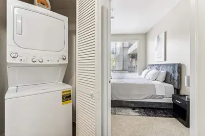 a bedroom with a bed and a tv in a room at Cozy Marina Hideaway Gym Pool & Spa Central in Los Angeles