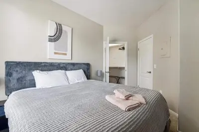 a bedroom with a bed with two towels on it at Cozy Marina Hideaway Gym Pool & Spa Central in Los Angeles