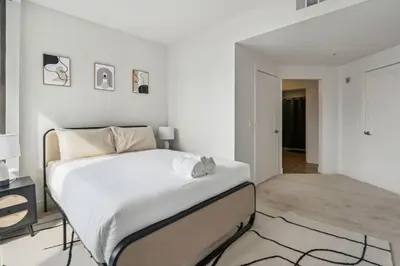 a white bedroom with a large white bed in it at Modern Marina Sanctuary Central Pool Gym Spa in Los Angeles