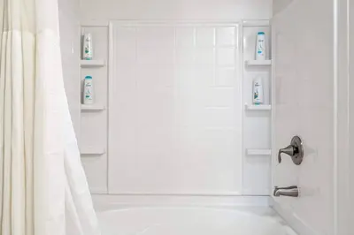 a bathroom with a shower with a shower curtain at Sleek Marina Den Central Gym Pool King Bed in Los Angeles