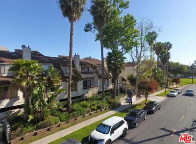 a street with cars parked in front of houses at 2 Bed Apartment with Private Terrace Near SoFi in Los Angeles