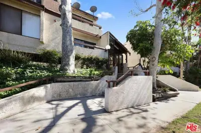 a house with concrete steps in front of a building at 2 Bed Apartment with Private Terrace Near SoFi in Los Angeles