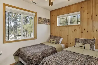 two beds in a room with two windows at Brownie Resort Your Walk-to-Summit Getaway Family's Snowboarders Skiers in Big Bear Lake