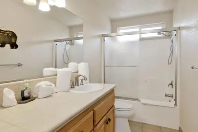 a bathroom with a sink and a toilet and a shower at Brownie Resort Retreat Walk-to-Ski Snow Summit Duplex Getaway in Big Bear Lake