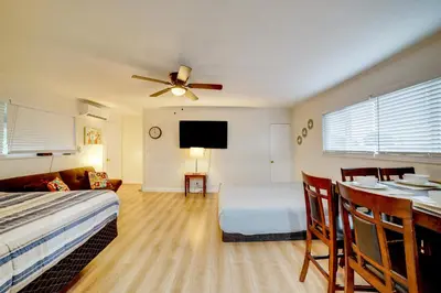 a bedroom with a bed and a table with a dining room at Work and Play! Studio 7 Mi to Dtwn San Bernardino in Rialto