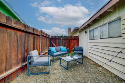 two chairs and a table on the side of a fence at 5 Mi to Dtwn Riverside and Hospital! Remote-Work Hub in Riverside