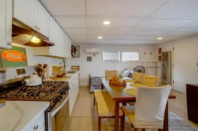 a kitchen and dining room with a stove and a table at 5 Mi to Dtwn Riverside and Hospital! Remote-Work Hub in Riverside