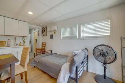a bedroom with a bed and a fan in a room at 5 Mi to Dtwn Riverside and Hospital! Remote-Work Hub in Riverside