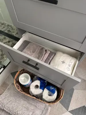 a drawer with towels and other items in it at Cozy Home near Beaches, LAX, SoFi, Intuit Dome,405 in Hawthorne