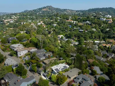 an aerial view of a town with houses and trees at Hillside Luxury MidCentury Modern Spa Retreat View in Los Angeles