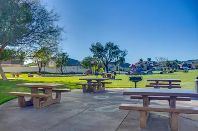 a group of picnic tables in a park at Family Home with Hot Tub! 2 Mi to Dtwn Riverside in Riverside