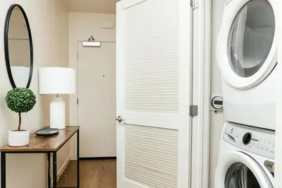 a laundry room with a washer and dryer at Beautiful 1BR with City Views in Los Angeles