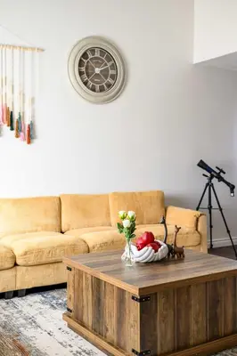 a living room with a couch and a coffee table at Stylish Retreat Large Living Space & Bright Suites in Norwalk