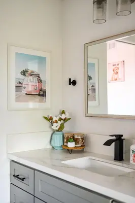 a white bathroom with a sink and a mirror at Stylish Retreat Large Living Space & Bright Suites in Norwalk