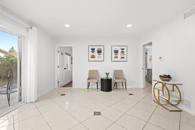 a white room with two chairs and a table at Cozy Full Suites Bright & Private Great Value in Norwalk