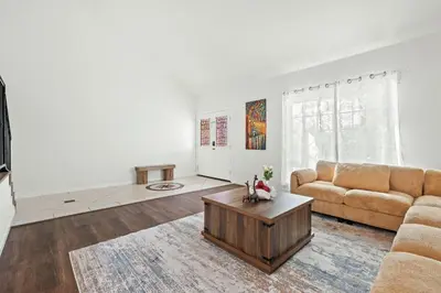 a living room with a couch and a coffee table at Cozy Full Bedroom Shared Home Great Value in Norwalk