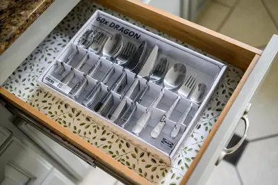 a drawer full of utensils in a wooden drawer at Cozy Full Bedroom Shared Home Great Value in Norwalk