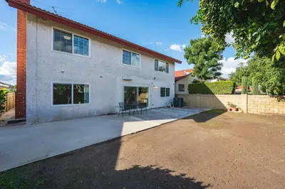 a house with a driveway in front of it at Premium Queen Room Private Ensuite Bright in Norwalk