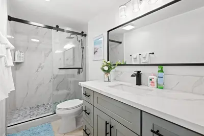 a white bathroom with a sink and a shower at Premium Queen Room Private Ensuite Bright in Norwalk