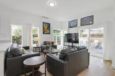 a living room with two leather couches and a television at New Family House Fanstic View Azusa in Azusa
