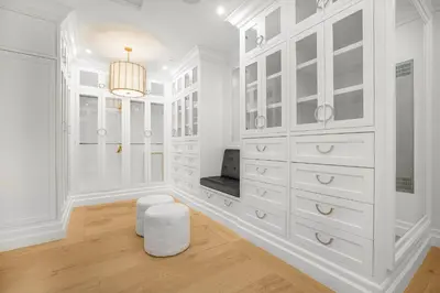 a white room with white cabinets and a stool at Spaulding Ave Farmhouse in Los Angeles