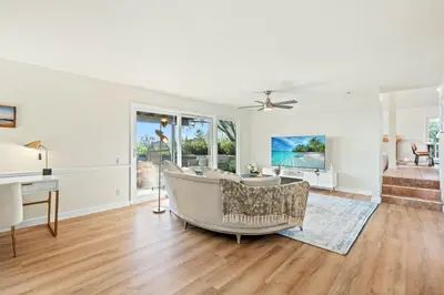 an empty living room with a couch and a tv at Spacious Retreat with Scenic Mountain Views in Santa Ana