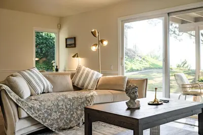 a living room with a couch and a coffee table at Spacious Retreat with Scenic Mountain Views in Santa Ana