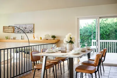 a dining room with a table and chairs at Spacious Retreat with Scenic Mountain Views in Santa Ana