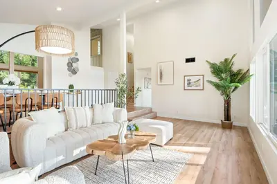 a living room with a couch and a table at Spacious Retreat with Scenic Mountain Views in Santa Ana