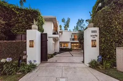 a walkway in front of a white house at Alta Royale in Los Angeles
