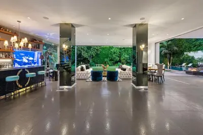 a lobby of a hotel with a bar and chairs at Alta Royale in Los Angeles