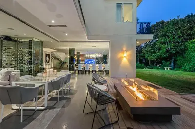 a living room with a fireplace in a house at Alta Royale in Los Angeles