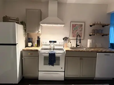 a kitchen with a white stove and a sink at Private getaway in Studio City Hills universal in Los Angeles