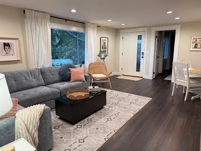 a living room with a couch and a table at Private getaway in Studio City Hills universal in Los Angeles