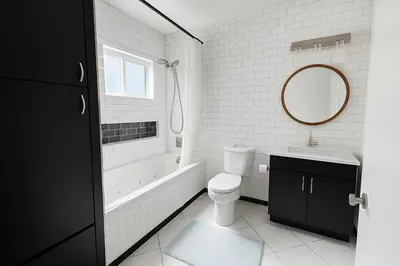 a bathroom with a tub and a toilet and a sink at Relaxing time in Pasadena in Pasadena