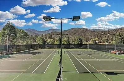 a tennis court with two tennis courts at Mountain Getaway - Stunning Views in Pine Mountain Club