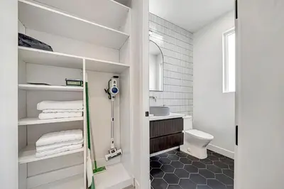 a bathroom with a toilet and a sink at Modern 3BR with King Bed, Gated Pool and BBQ Oasis in West Valley Area Heliport