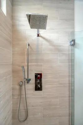 a bathroom with a shower with a shower head at Ultra Luxe Estate With Pool and Stunning 360 LA Views in Los Angeles