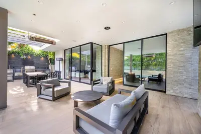 a living room with a couch and chairs at Ultra Luxe Estate With Pool and Stunning 360 LA Views in Los Angeles