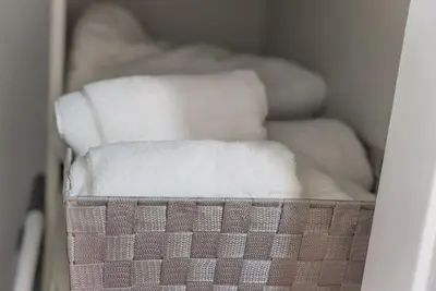 a bunch of white towels in a closet at Urban retreat- Quiet comfy 1 bedroom condo near LAX in Los Angeles
