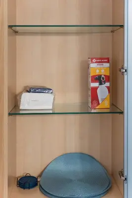 a shelf with a blue rug and a box at Urban retreat- Quiet comfy 1 bedroom condo near LAX in Los Angeles