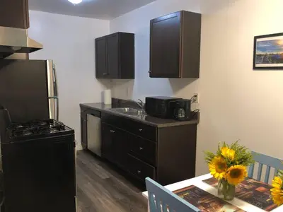 a kitchen with a sink and a counter top at Modern 1 Bedroom Hollywood Apartment Near Larchmont Village Walk of Fame and Studios in Los Angeles